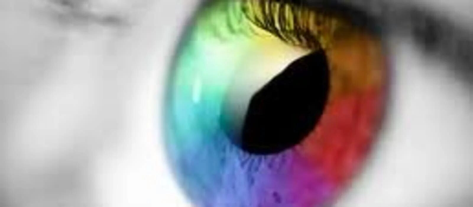 Photo of an eye with a multi coloured iris