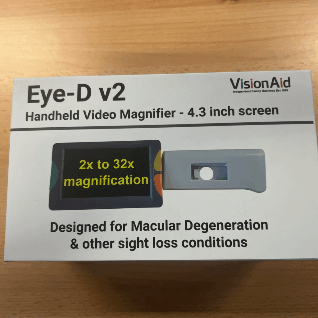 Box containing Eye-D v2 Handheld magnifier 4.3 inch screen 2x to 32x magnification.